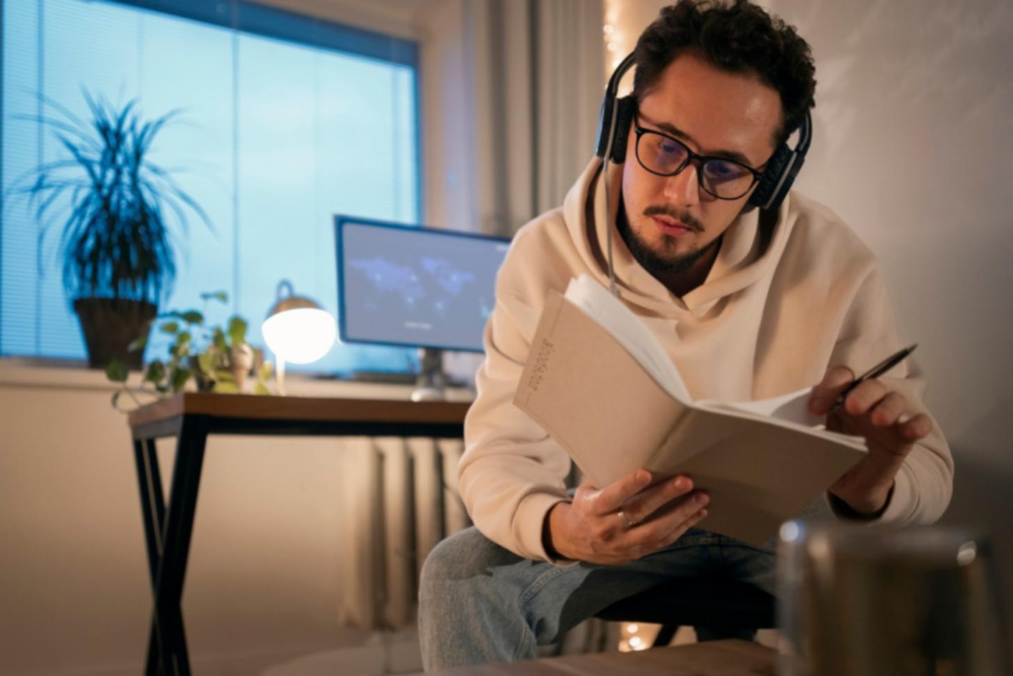 Student reviewing budget spreadsheet with instructor guidance